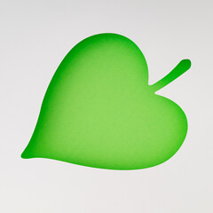 Leaf shape made with green and white paper. Minimal concept. Creative copy space for product or text. Flat lay, top of view.