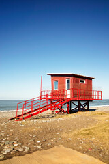 Red Lifeguard Tower on Batumi Beach with Clear Blue Sky