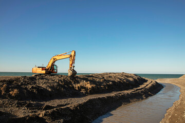 Excavator Digging a Trench on the Seaside in Batumi, Georgia