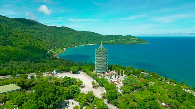 Thap Xa Loi stands majestically near the coast, surrounded by lush greenery and overlooking the serene waters of Da Nang.