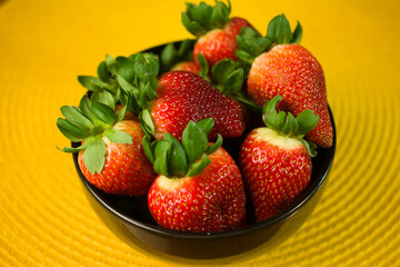 Ripe Strawberries in Black Ceramic Bowl