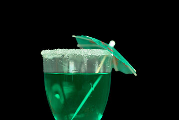St. Patrick’s Day festive green drink with sugar rim and green accents on black