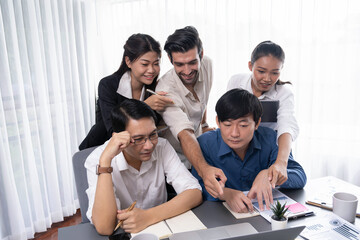 Group of diverse office worker employee working together on strategic business marketing planning in corporate office room. Positive teamwork in business workplace concept. Prudent