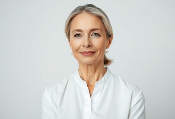 Fototapeta premium Serene middle-aged female portrait with calm expression