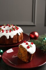 Traditional classic Christmas cake and decor on gray textured table