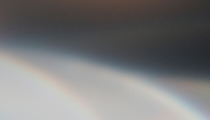Rainbow gradient crossing a blurry gray background