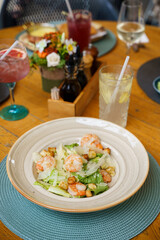 Shrimp Caesar salad with Parmesan and croutons