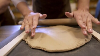 Hands Skillfully Working with Clay during an Engaging Pottery Class Experience in a Studio. Stock Clip