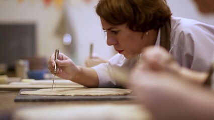 A dedicated focus on craftsmanship within an engaging and creative workshop environment. Stock Clip