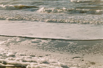 Seafoam on beach