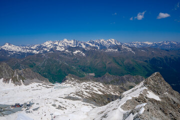 Breathtaking View of the Italian Alps Captured in Vermiglio Showcasing Snow-Capped Peaks and Lush...