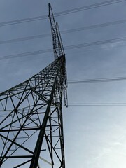 Towering Power Lines Against Clear Sky