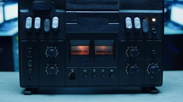 Tape audio music player, studio magnetic tape, vintage retro spool reel to reel player and recorder, magnetic tape data storage close up, music studio. 