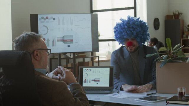 Office worker carrying box with his belongings, throwing resignation letter, emotionally scolding and giving clown wig and nose to boss while quitting his annoying job