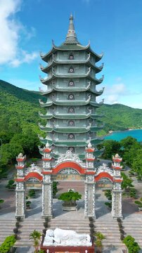 Thap Xa Loi is a serene Buddhist temple in Da Nang featuring a majestic multi-tiered pagoda surrounded by lush greenery and a tranquil coastal view.