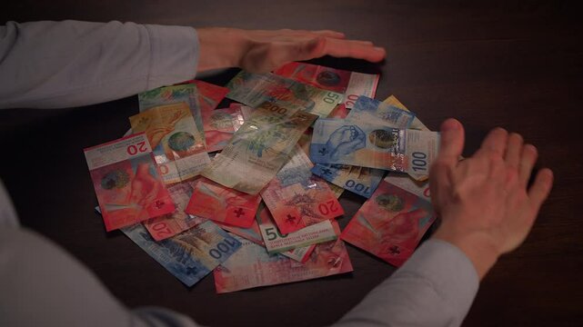 Close up dolly shot showing many different swiss franc banknotes - Cash Money Counting. Swiss Francs Banknotes