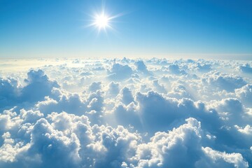 Fototapeta premium Expansive view of sunlit fluffy clouds above the horizon under a clear sky