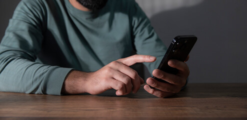 man holds the phone in his hand.