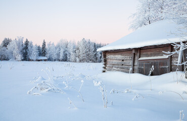 old house in the mountains during snowy winter