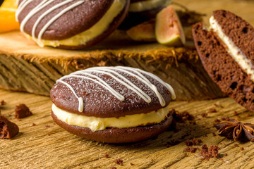 Whoopie pie with orange cream. Delicious homemade dessert