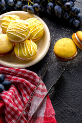 Homemade round lemon cookies. French sweet yellow cookies macarons