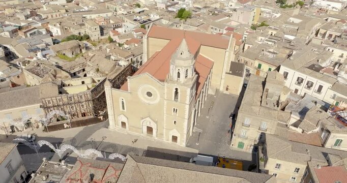 Aerial view of the Basilica of Santa Maria Assunta in the historic center of Lucera, in province of Foggia, Puglia, Italy. The cathedral of the town is dedicated to the Assumption of the Virgin Mary.