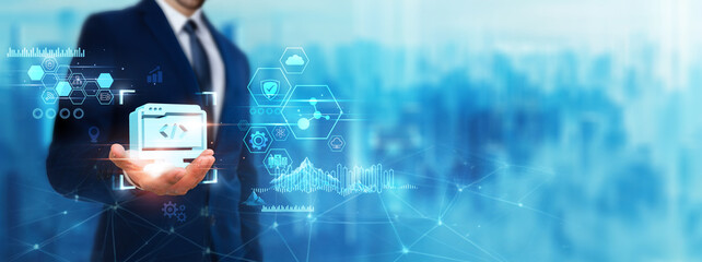 Web Development: Businessman holding web development icon. Digital technology era of future....
