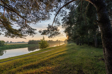 Beautiful, serene scene of a river with a path running alongside it