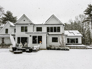  Snowy morning in late fall covers rooftop solar panels