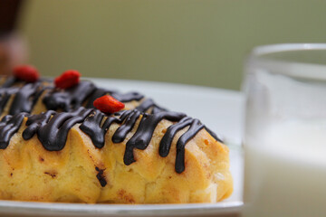 Chocolate Drizzled Eclairs Close Up Sweet Dessert on Elegant Plate Indonesian Cuisine Asian Food