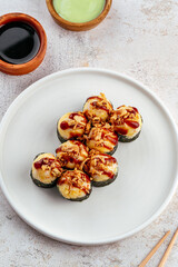 traditional Japanese sushi rolls on a plate