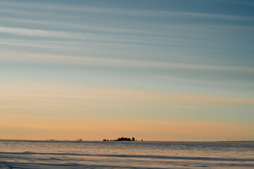 Vast sky at sunrise over rural farm fields.