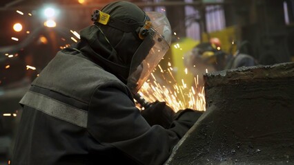 An Industrial Worker Welding Producing Fiery Sparks in a Factory Environment with Precision. Stock Clip