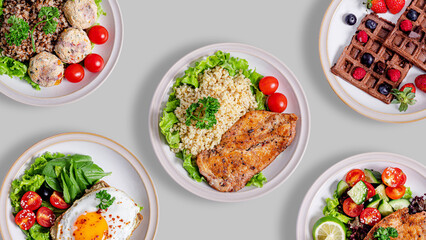 Food assortment on grey background. Chicken schnitzel with bulgur, waffles, fried eggs with tomatoes, buckwheat with meatballs