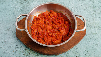 Eggs with tomato in metallic bowl