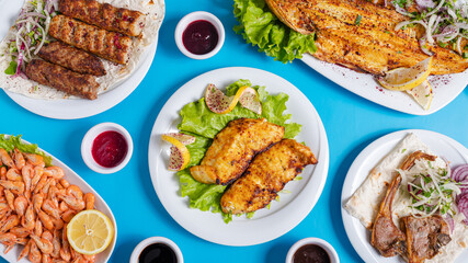 Food assortment. Grilled fish, lula kebab, shrimps
