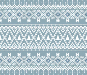 Cozy winter pattern featuring geometric shapes, trees, and bows in blue and white. Perfect for festive designs and textiles