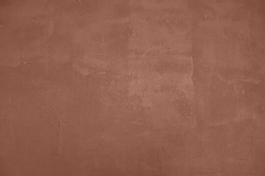 Mocha Mousse toned colour grunge decorative wall background. Art rough stylized texture banner trendy color 2025. Grunge brown color texture