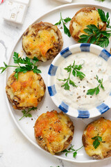 Baked mushrooms stuffed with cheese with sauce.selective focus