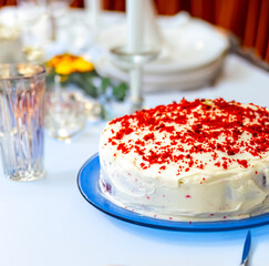 Traditional and delicious red velvet cake isolated on blue plate
