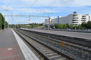 Obraz premium Espoo railway station is a railway station in the district of Espoon keskus in the city of Espoo, Finland. It is between the stations of Tuomarila and Kauklahti.