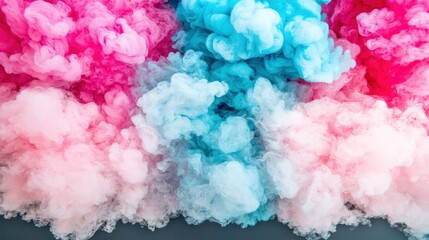 Fototapeta premium Colorful smoke clouds in shades of pink and blue.