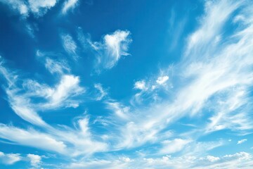 A clear blue sky with wispy white clouds creating a serene atmosphere.