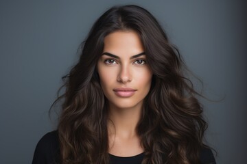 Fototapeta premium A woman with long brown hair and a nice smile