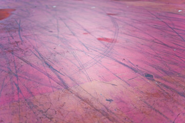 Close up surface red floor with bicycle tire marks textured background