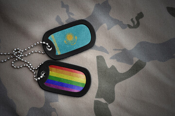 army blank, dog tag with rainbow gay pride flag and kazakhstan on the khaki texture background....