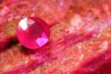 Beautiful shiny pink gemstone on natural mineral, closeup