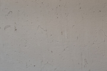 Uneven wall with gypsum plaster. Gray rough wall with plastered surface. Finishing walls in the apartment with plaster