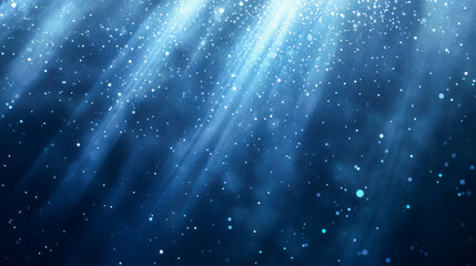 Obraz premium Mystical underwater light rays and floating particles in deep blue ocean