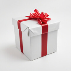 Obraz premium A wrapped gift box with a red ribbon bow on a white background